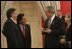 President George W. Bush meets with President Alejandro Toledo of Peru, Manuel Rodriguez Cuadros, Foreign Minister of Peru, far left, and President Toledo's wife, Ms. Elaine Karp, during the APEC Summit at La Moneda Presidential Palace in Santiago, Chile, Sunday, Nov. 21, 2004. 