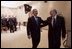 President George W. Bush and Canadian Prime Minister Paul Martin share a light moment after a bilateral meeting in Santiago, Chile, Nov. 20, 2004. President Bush and Prime Minister Martin are joined in Chile by the leaders of 19 other countries attending this year's APEC summit.