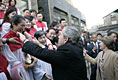 President George W. Bush reaches out to church members Sunday, Nov. 20, 2005, at the Gangwashi Church in Beijing after he and Mrs. Bush attended services.