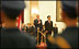 President George W. Bush and President Hu Jintao of China are viewed through the honor guard during welcoming ceremonies for the President and Mrs. Bush at the Great Hall of the People in Beijing.