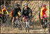 President George W. Bush leads the pack as he joins China's Mountain Biking Team for a ride Sunday afternoon, Nov. 20, 2005, in Beijing.