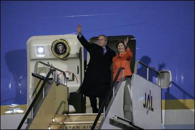 President George W. Bush and Laura Bush wave from Air Force One Tuesday, Nov. 15, 2005, after arriving at Osaka International Airport in Osaka, Japan.