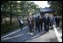 President George W. Bush and Japan’s Prime Minister Junichiro Koizumi join the Reverend Raitei Arima, Chief Priest of the Golden Pavilion Kinkakuji Temple in Kyoto, Japan, Wednesday, Nov. 16, 2005.