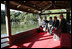 President George W. Bush, Mrs. Bush, Japan’s Prime Minister Junichiro Koizumi and the Reverend Raitei Arima, Chief Priest of the Golden Pavilion Kinkakuji Temple, pause during a cultural visit to the temple Wednesday, Nov. 16, 2005, in Kyoto.