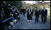 President George W. Bush and Japan’s Prime Minister Junichiro Koizumi join the Reverend Raitei Arima, Chief Priest of the Golden Pavilion Kinkakuji Temple in Kyoto, as they walk past the press during a cultural visit to the temple Wednesday, Nov. 16, 2005.