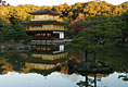 The Golden Pavilion Kinkakuji Temple is reflected in the pool as the sun rises over Kyoto, Japan, Wednesday, Nov. 16, 2005.