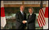 President George W. Bush and Prime Minister Junichiro Koizumi of Japan, shake hands Wednesday, Nov. 16, 2005, prior to their meeting at the Kyoto State Guest House in Kyoto, Japan.