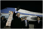 President George W. Bush waves to well-wishers Wednesday, Nov. 16, 2005, after arriving in Busan, South Korea, where he will attend the APEC conference later in the week.