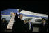 President George W. Bush waves to well-wishers Wednesday, Nov. 16, 2005, after arriving in Busan, South Korea, where he will attend the APEC conference later in the week.