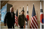 President George W. Bush and Moo Hyun Roh, President of the Republic of Korea, leave the stage at the Hotel Hyundai in Gyeongju, Korea Thursday, Nov. 17, 2005, after a joint press availability.