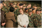 Laura Bush smiles back at the troops Saturday after she and the President stopped en route to China at Osan Air Base in Osan, Korea.