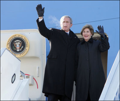 President and Mrs. Bush wave from the top of the steps as they deplane Air Force One Monday, Nov. 21, 2005, in Ulaanbaatar, Mongolia. The stop marks the first time a working U.S. president has visited the country. 