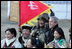 President George W. Bush poses for photos with a Mongolia horseman and other participants of a cultural event in Ikh Tenger, near the capital city of Ulaanbaatar, during a visit Monday, Nov. 21, 2005, by the President and Mrs. Bush. 