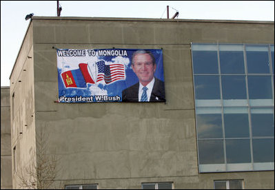 A sign welcoming "George and Laura" to Mongolia adorns a building at Buyant-Ukhaa Airport in Ulaanbaatar, Mongolia, as the President and First Lady arrived on the last stop of their Asia tour. 