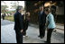 President and Mrs. Bush are greeted by the Reverend Raitei Arima, Chief Priest at the Golden Pavilion Kinkakuji Temple, and Japan’s Prime Minister Junichiro Koizumi, at the doors of the temple Wednesday, Nov. 16, 2005, in Kyoto.