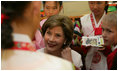 Laura Bush listens to children in the Children's Reading Room of the Busan Simin Metropolitan Municipal Library Friday, Nov. 18, 2005, in Busan, Korea.