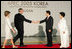 President and Mrs. Bush are welcomed by President Moo Hyun Roh of the Republic of Korea, and his wife, Yang-Sook Kwon, to the Gala Dinner and Cultural Performance at the 2005 APEC summit Friday night, Nov. 18, 2005.