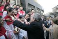 President George W. Bush reaches out to church members Sunday, Nov. 20, 2005, at the Gangwashi Church in Beijing after he and Mrs. Bush attended services.