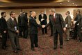 President George W. Bush and Russian President Vladimir Putin exchange handshakes Friday, Nov. 18, 2005, after their meeting in Busan, Korea, prior to the opening of the 2005 APEC conference.