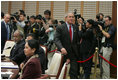 President George W. Bush arrives for the second APEC retreat Saturday, Nov. 19, 2005, at the Nurimaru APEC House in Busan.