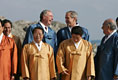 President Bush and Canada's Prime Minister Paul Joseph Martin break out in laughter Saturday, Nov. 19, 2005, as they stand in on the back riser for the official APEC photograph.