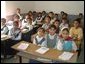 Iraqi primary school children enjoy a new day of education in their newly rehabilitated class room.