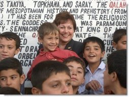 Agriculture Secretary Ann M. Veneman with children in Iraq.