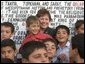 Agriculture Secretary Ann M. Veneman with children in Iraq.