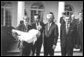 Photograph of President Nixon receiving a Thanksgiving turkey from members during the annual pardoning ceremony.