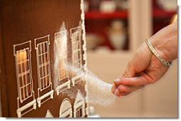 Thaddeus DuBois, White House Executive Pastry Chef, adds finishing touches of sugar to the windows of the official White House gingerbread house. White House Photo by Shealah Craighead