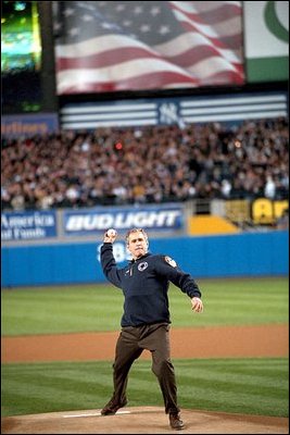 President George W. Bush throws out the first pitch during game three of the World Series game between the Arizona Diamondbacks and the Yankees at Yankee Stadium Oct. 3, 2001.