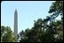 President George W. Bush discusses his Clear Skies Initiative in the East Garden Tuesday, Sept. 16, 2003. The initiative mandates a 70 percent cut in air pollution from power plants over the next 15 years, including the first-ever national cap on mercury emissions. 