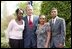 President George W. Bush congratulates the Groundwork Providence Environmental Team of Providence, R.I., on receiving the President’s Environmental Youth Award in the East Garden April 22, 2004. Members of the team include, from left to right, Olabisi Davies, 17, Taja Gonsalves, 15, and Miguel Blanco, 16. 