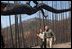 President George W. Bush tours the Squires Peak Fire Area in Medford, Ore., with Ron Wenker of the Medford Bureau of Land Management Properties District, Thursday, Aug. 22, 2002. 