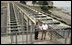 President George W. Bush talks with Witt Anderson during a tour of the Ice Harbor Lock and Dam in Burbank, Wash., Friday,August 22, 2003.