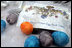 Rain swirls with Easter egg dye to create intricate patterns on a few of the more than 10,000 eggs prepared for the 2005 White House Easter Egg Roll.