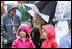 Holding a chocolate egg, two girls dress in appropriate style for the occasion. Children attending the event took part in reading corners, egg coloring, art activities, face painting and many other activities.