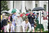 President George W. Bush is joined by Mrs. Laura Bush as he blows a whistle to start the Easter Egg Roll races on the South Lawn of the White House during the 2006 White House Easter Egg Roll, Monday, April 17, 2006. The first White House Easter Egg Roll was held in 1878.