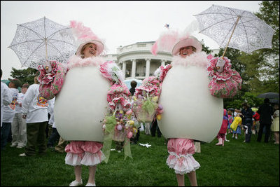 White House volunteers dressed in festive egg costumes stroll the South Lawn of the White House during the 2006 White House Easter Egg Roll, Monday, April 17, 2006.