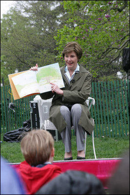 Mrs. Laura Bush reads a story to children attending the 2006 White House Easter Egg Roll, Monday, April 17, 2006 on the South Lawn of the White House.