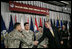 El Presidente George W. Bush junto al técnico del Ejército Sergio López de Bowlingbrook, Ill., el técnico del Ejército Noe Santos-Dilone de Brooklyn, NY., y el soldado raso del Ejército Eduardo Leal-Cárdenas durante una Ceremonia de Naturalización en Walter Reed Army Medical Center en Washington, D.C. el lunes, 24 de julio de 2006. Foto por Eric Draper de la Casa Blanca. 