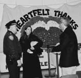 Fellows Bobbi Shea and Steve Poizner talke with officers at the command post at Ground Zero.