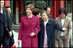 Mrs. Bush and Madame Wang, wife of Chinese President Jiang Zemin, walk from a welcoming tea ceremony at Yuan Dian Hall to lunch in the Xiang Yi Dian Hall in the Zhongnanhai compound Friday, February 22, 2002 in Beijing. White House photo by Eric Draper.