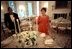 With just minutes to go before hosting her first State Dinner, Laura Bush lights the first candles of the first state dinner, September 5, 2001. 