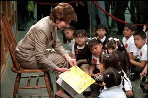 Mrs. Bush reads to a group of children. White House photo by Paul Morse