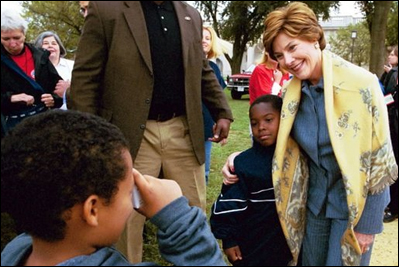 Mrs. Bush poses with children during her visit to the 2003 National Book Festival on the National Mall in Washington, D.C., Oct. 4, 2003.