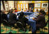 The President and Mrs. Bush sit among children of prisoners, their mentors and administrators Friday, April 1, 2005, during a roundtable discussion at Paul Public Charter School in Washington DC. The president met with the kids and others as part of his Helping America's Youth initiative.