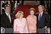 President George W. Bush and Ukraine President Viktor Yushchenko are joined at the podiums by first ladies Laura Bush and Kateryna Yushchenko Monday, April 4, 2005, in the East Room of the White House.