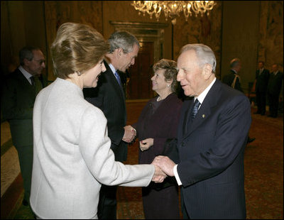 President George W. Bush and first lady Laura Bush are greeted upon their arrival to Quirinale Palace by Italy's President and first lady, Carlo and Franca Ciampi, Thursday, April 7, 2005. President and Mrs. Bush paid the courtesy visit while in Rome for the funeral of Pope John Paul II.