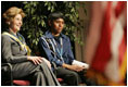 Laura Bush sits with 16-year-old Derwin Tekala, a participant in the Red Road Youth Empowerment Project, before delivering remarks at the Heard Museum in Phoenix, Ariz., April 26, 2005. Mrs. Bush discussed the role of strong family and cultural bonds in helping children resist negative social pressures.